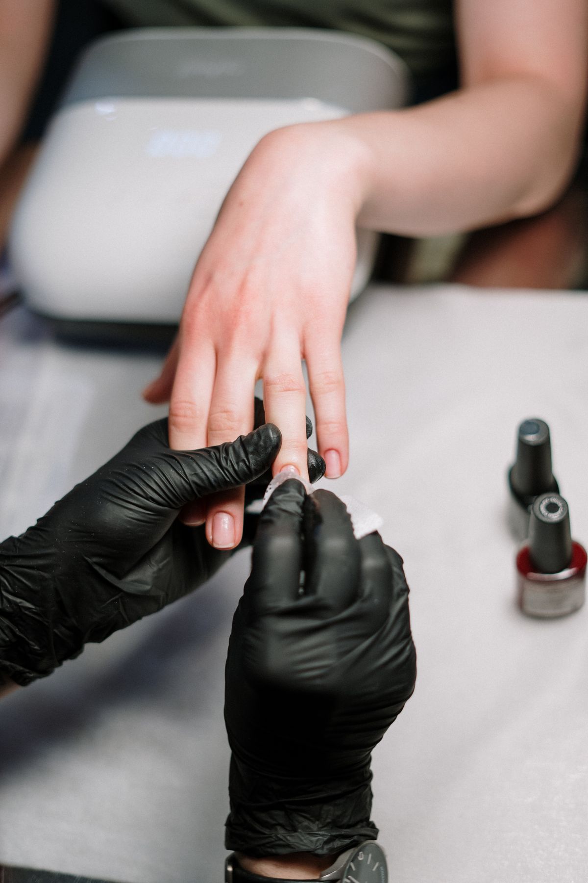 Manicure in progress at Glossy Nails Spa
